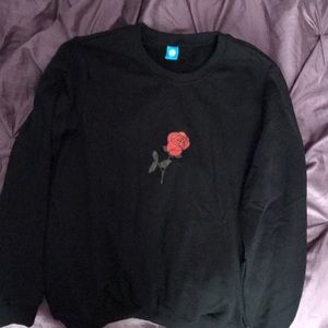 black sweatshirt with a rose